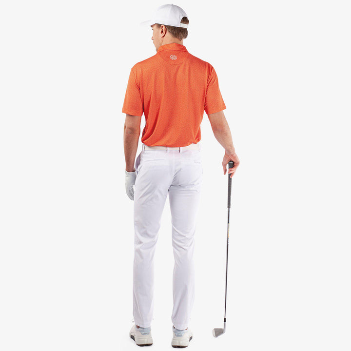 Mani is a Breathable short sleeve golf shirt for Men in the color Orange(7)