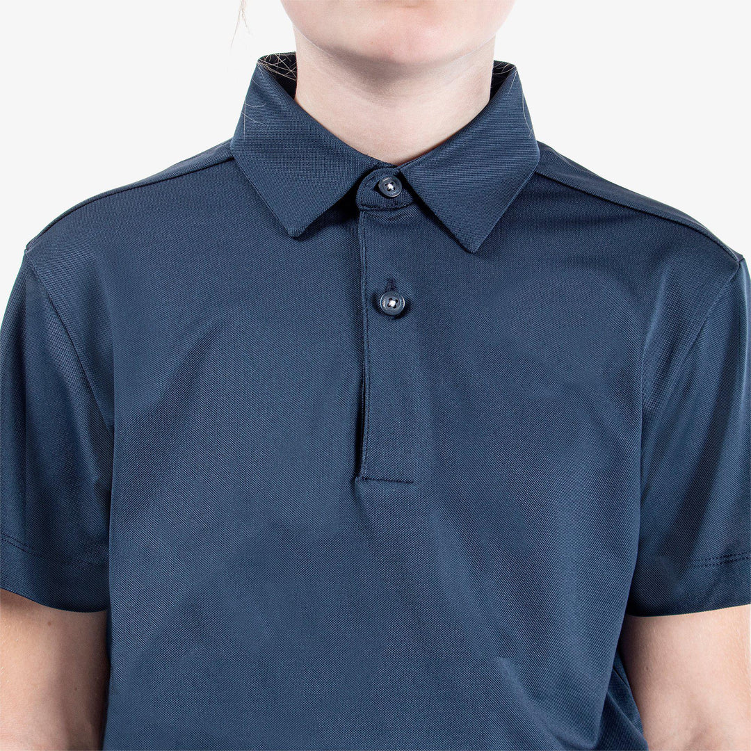 Rylan is a Breathable short sleeve golf shirt for Juniors in the color Navy(3)