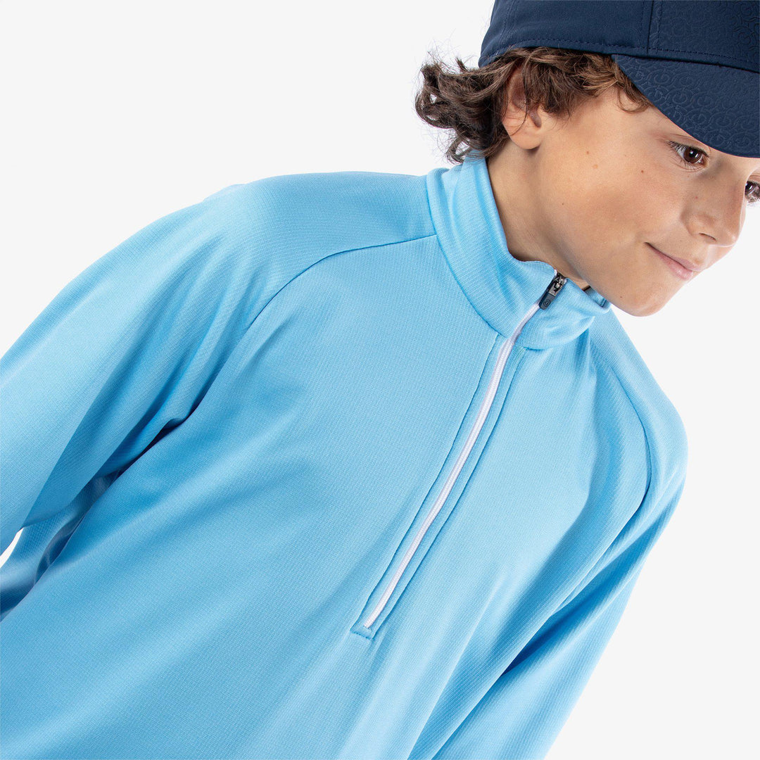 Raz is a Insulating golf mid layer for Juniors in the color Alaskan Blue(3)