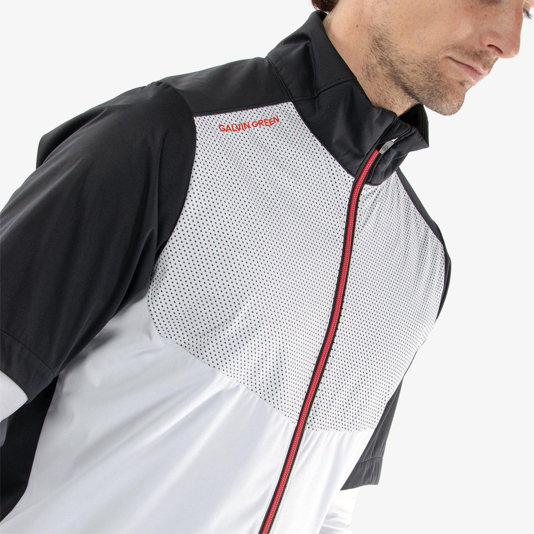 Livingston is a Windproof and water repellent short sleeve golf jacket for  in the color White/Black/Red(3)