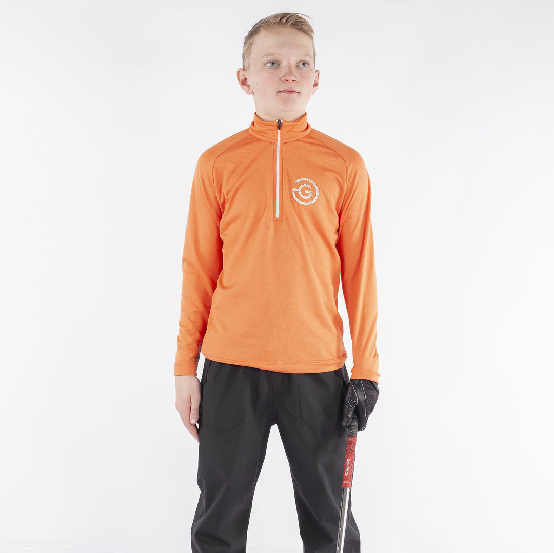Raz is a Insulating golf mid layer for Juniors in the color Orange(1)