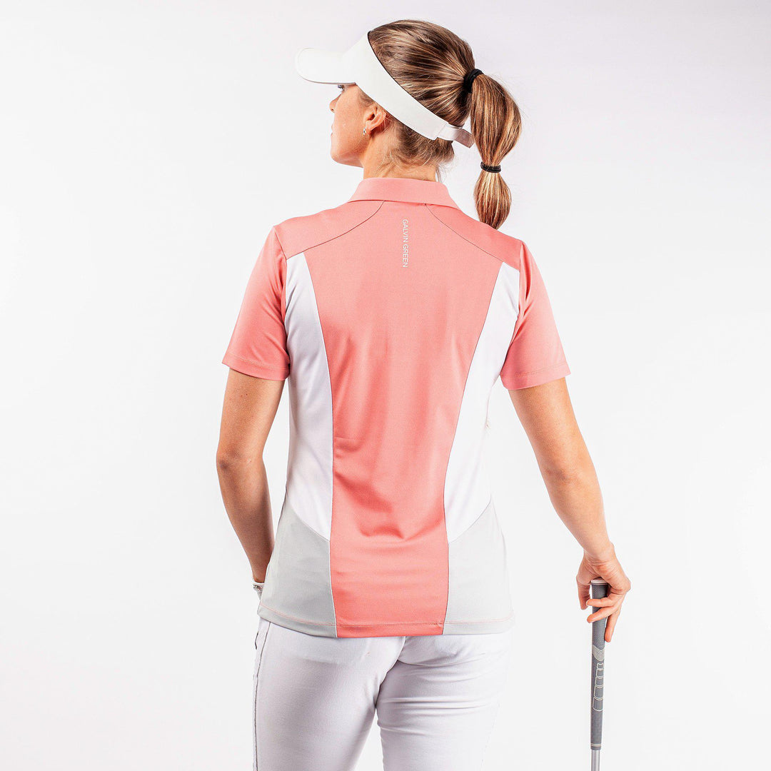 Melanie is a Breathable short sleeve golf shirt for Women in the color Coral/White/Cool Grey(5)