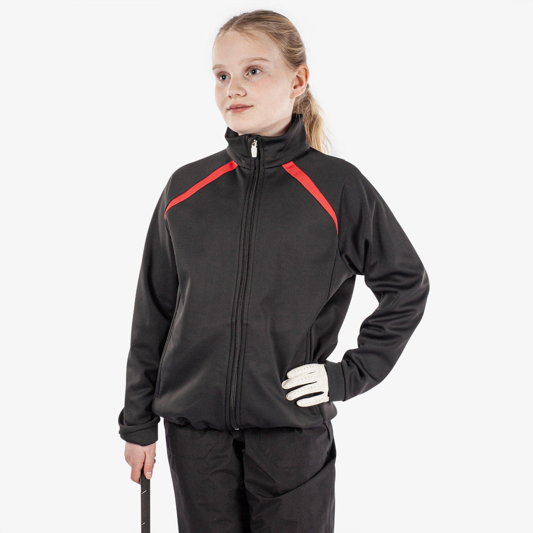 Reine is a Windproof and water repellent golf jacket for Juniors in the color Black(1)