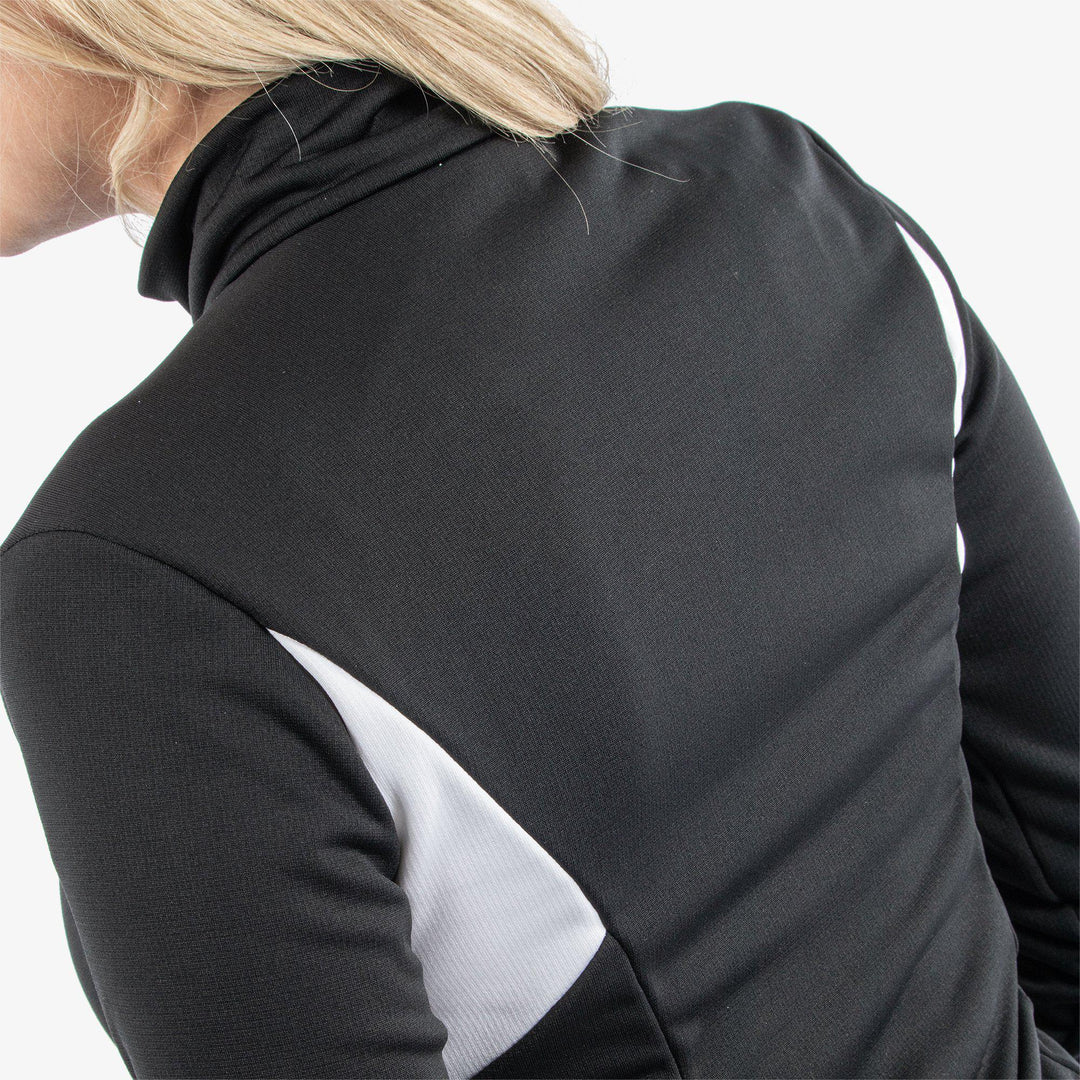 Destiny is a Insulating golf mid layer for Women in the color Black/White(5)