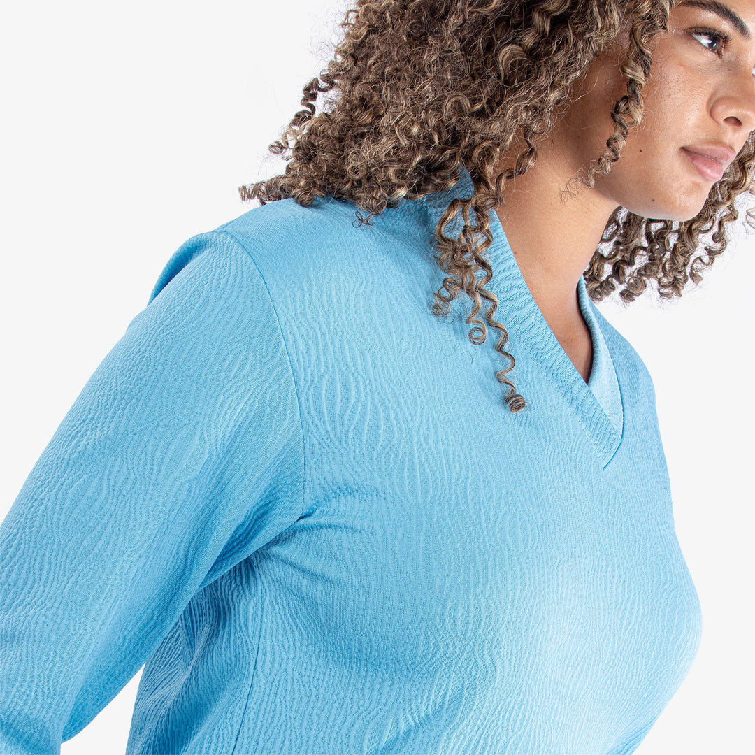 Donya is a Insulating golf mid layer for Women in the color Alaskan Blue(3)
