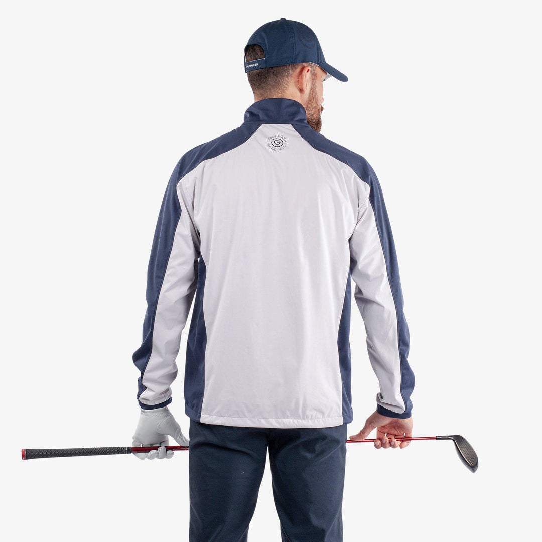 Lawrence is a Windproof and water repellent golf jacket for Men in the color White/Navy(4)