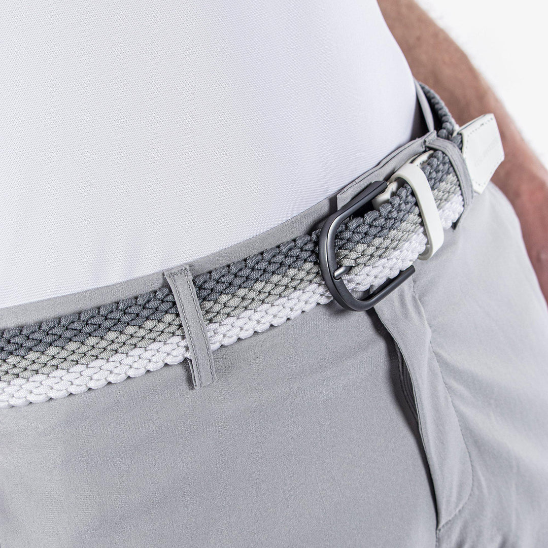 Will is a Elastic golf belt in the color White/Cool Grey/Sharkskin(3)