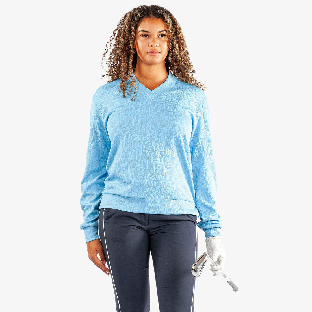 Donya is a Insulating golf mid layer for Women in the color Alaskan Blue(1)