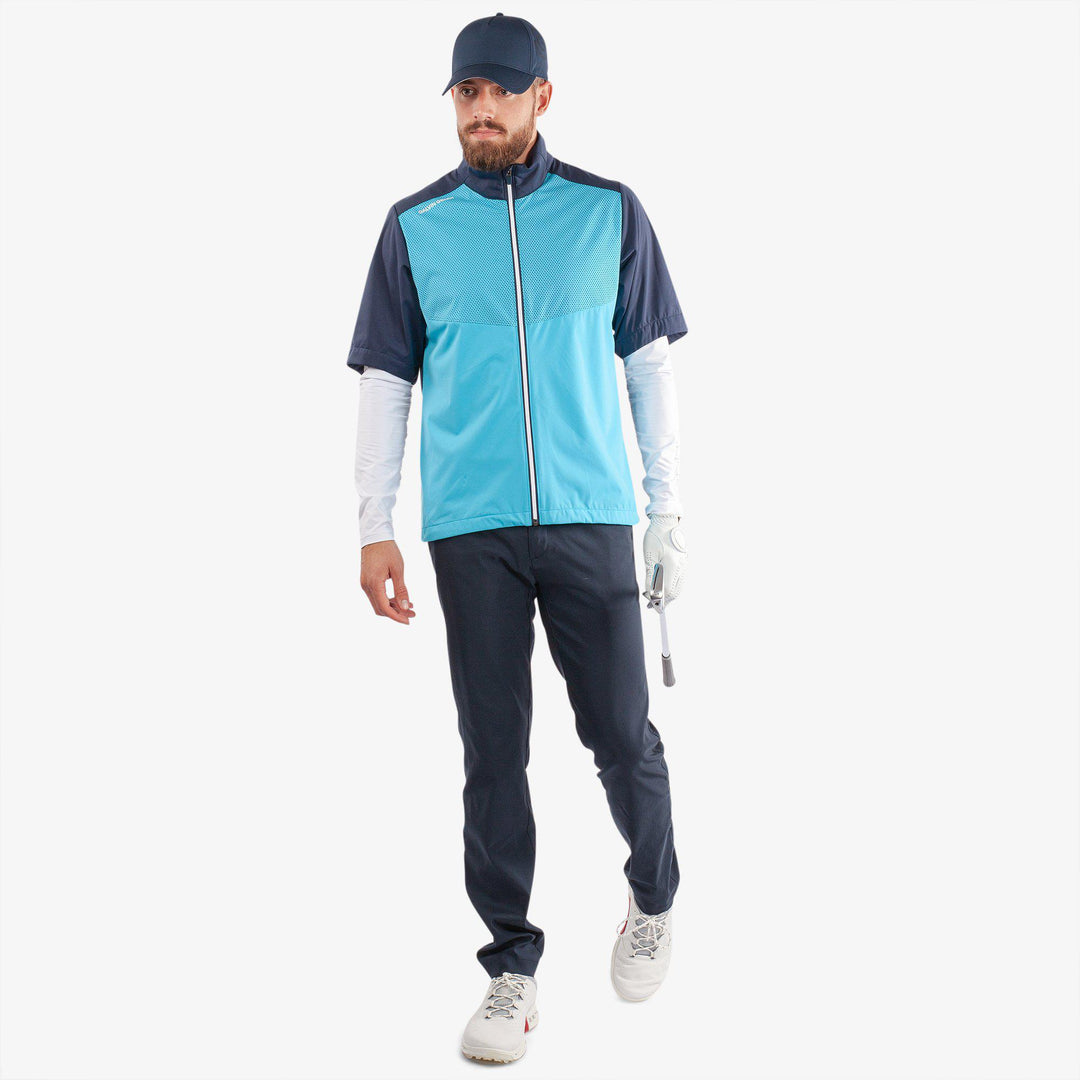 Livingston is a Windproof and water repellent short sleeve golf jacket for  in the color Aqua/Navy(2)