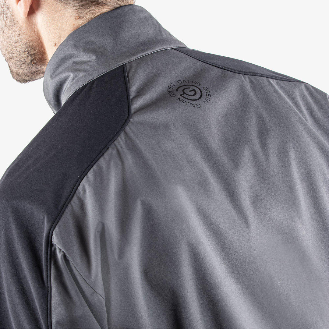 Lawrence is a Windproof and water repellent jacket for  in the color Forged Iron/Black/Red(7)