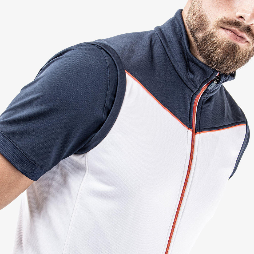Davon is a Insulating golf vest for Men in the color White/Navy/Orange(3)