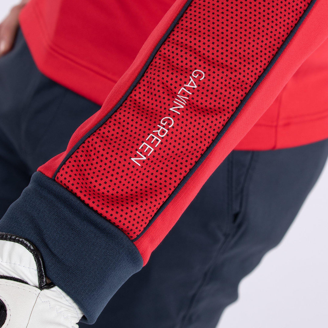 Daxton is a Insulating golf mid layer for Men in the color Imaginary Red(3)