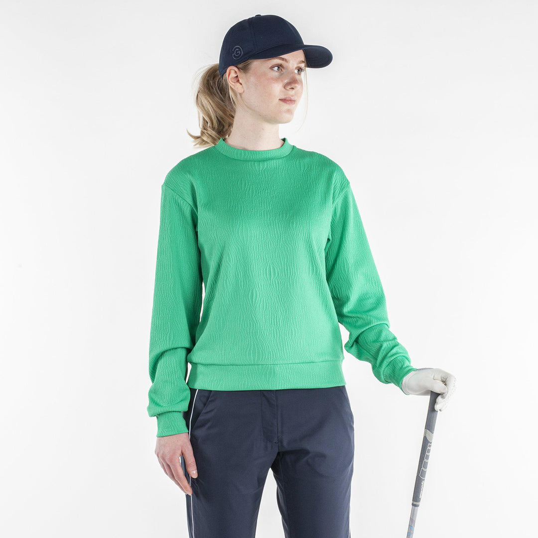 Dalia is a Insulating mid layer for Women in the color Golf Green(1)