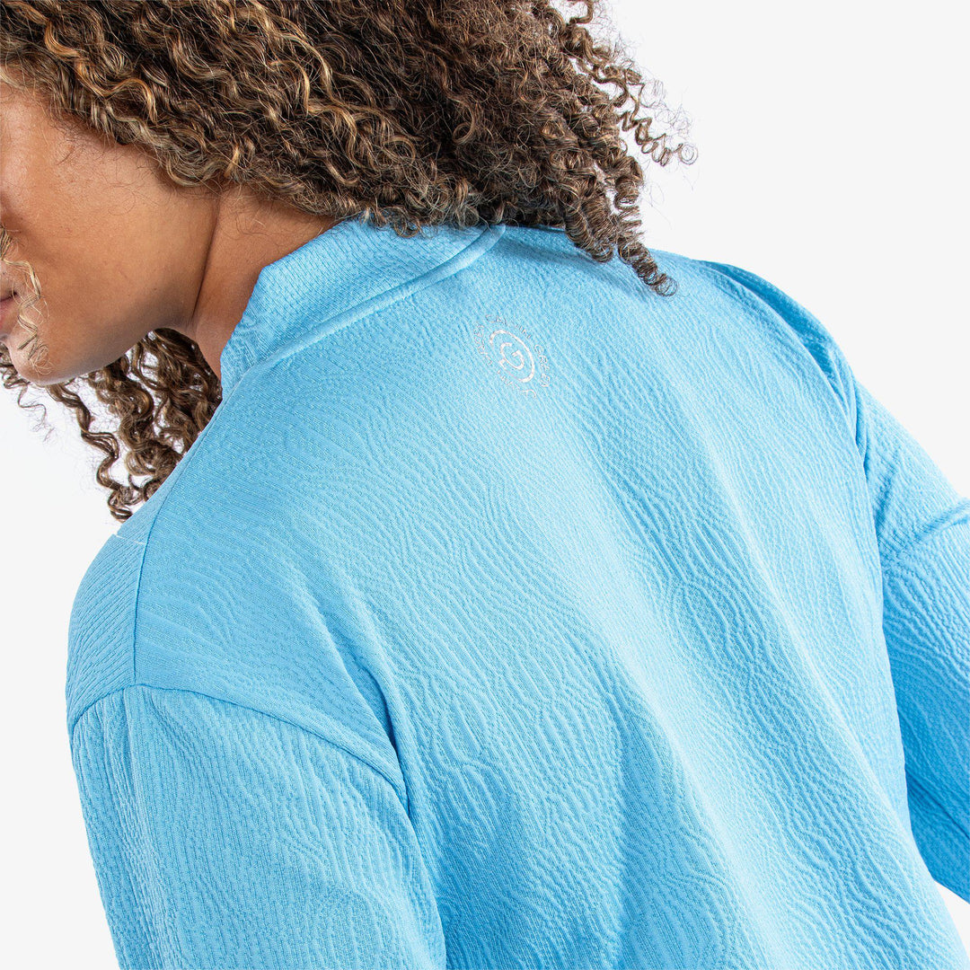 Donya is a Insulating golf mid layer for Women in the color Alaskan Blue(5)