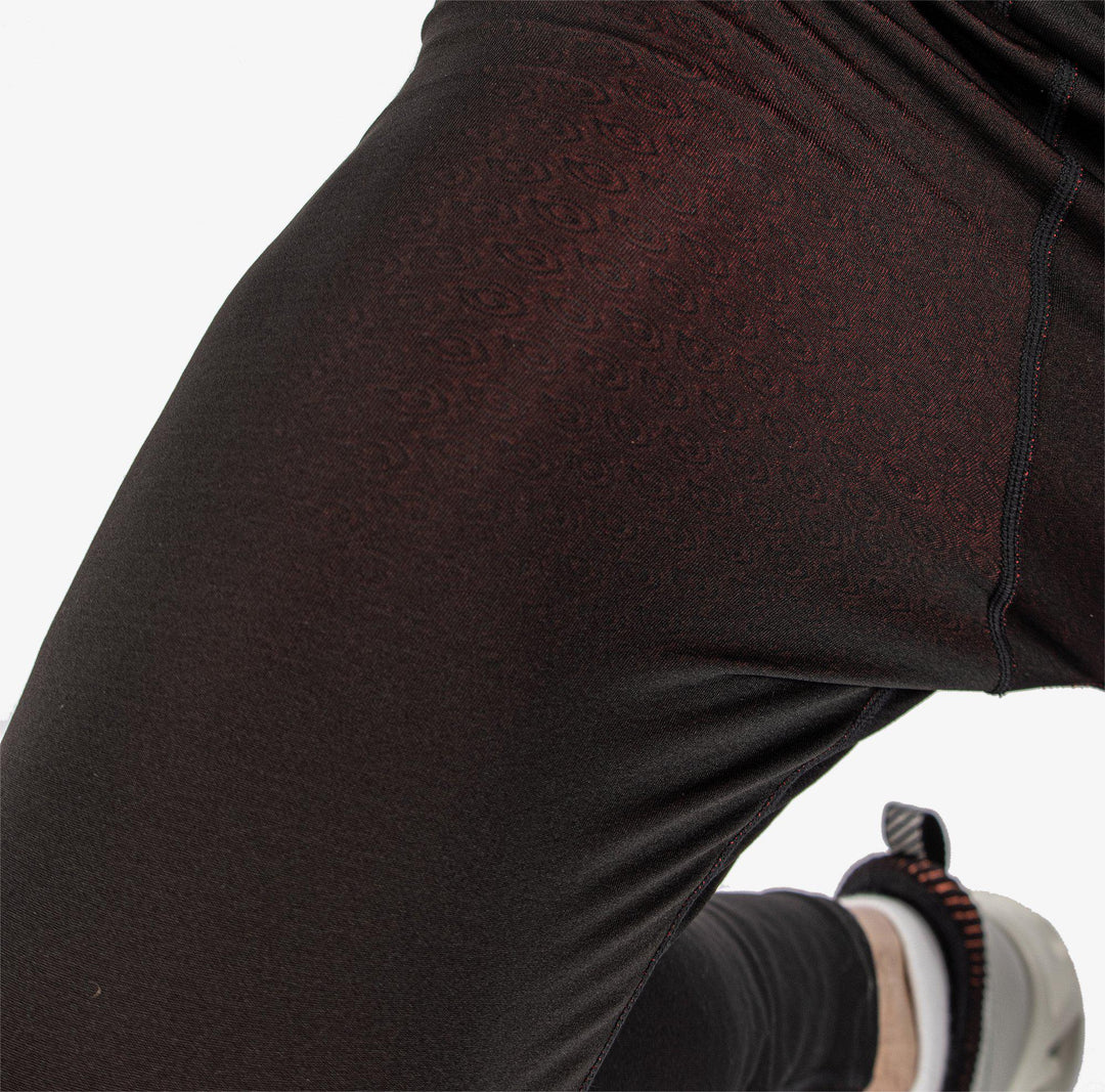 Elof is a Thermal base layer golf leggings for Men in the color Black/Red(6)