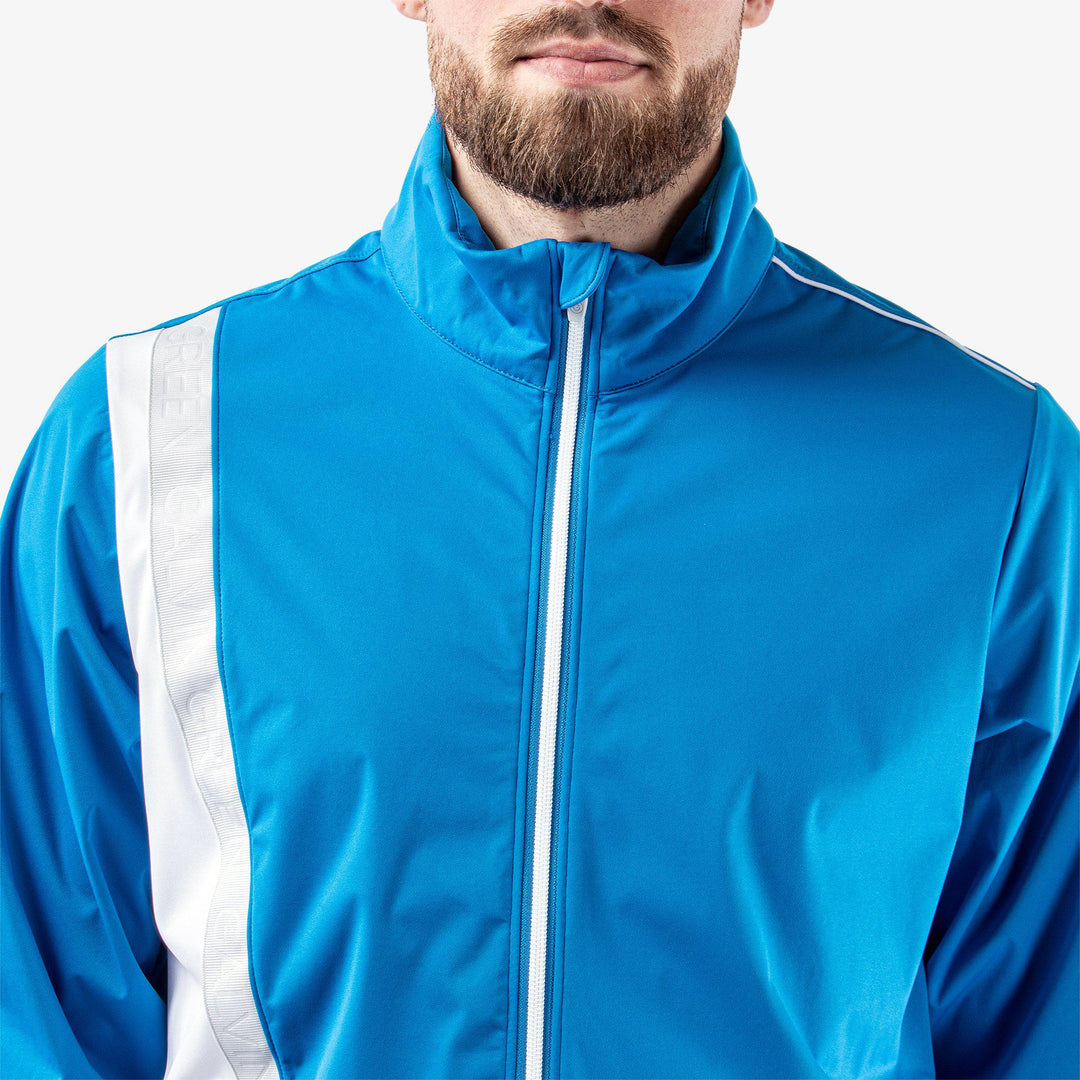 Lucien is a Windproof and water repellent jacket for  in the color Blue/White/Cool Grey(3)