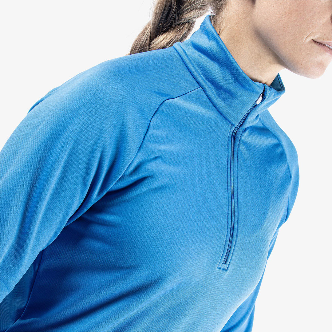 Dolly is a Insulating golf mid layer for Women in the color Blue(3)