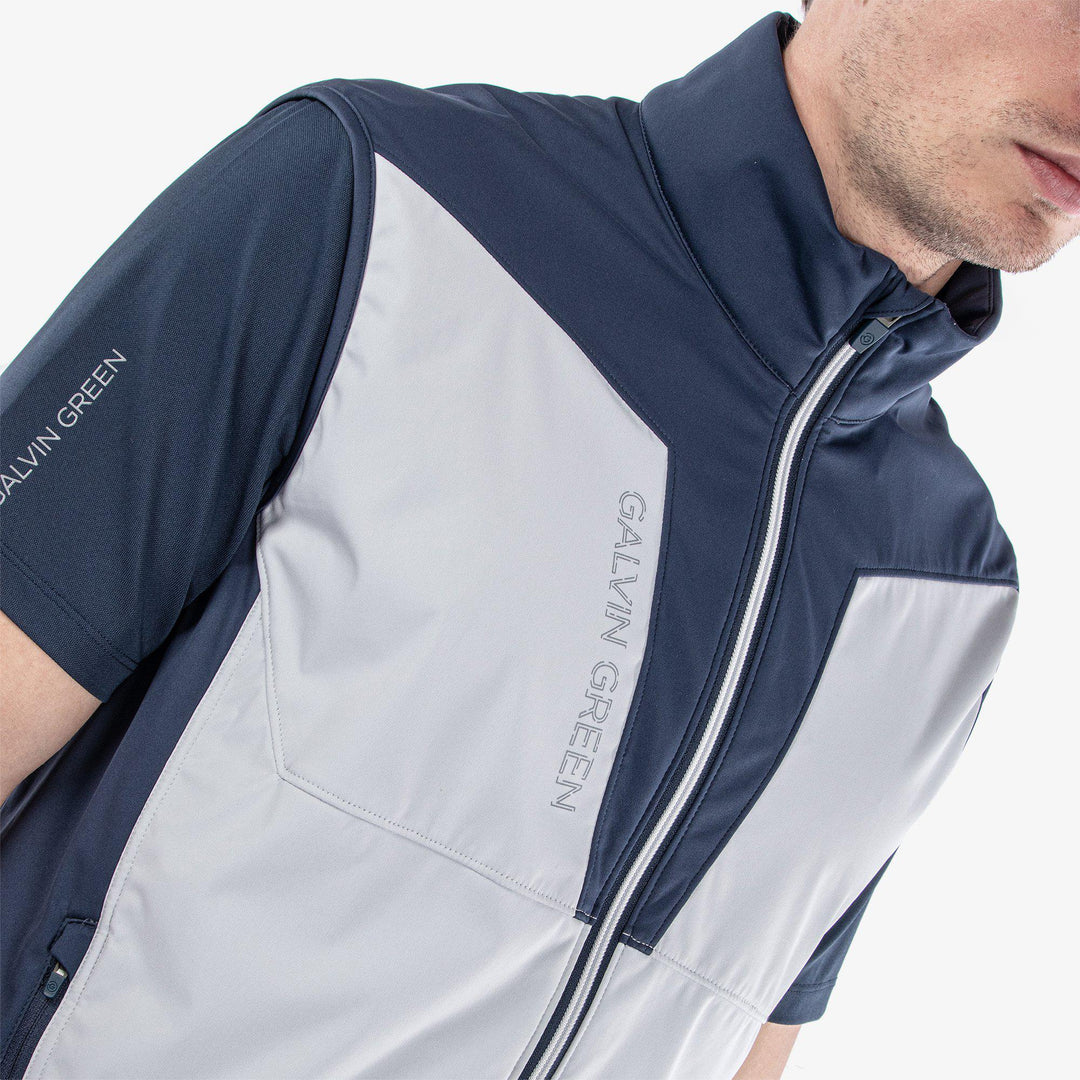 Lathan is a Windproof and water repellent golf vest for Men in the color Cool Grey/Navy(3)