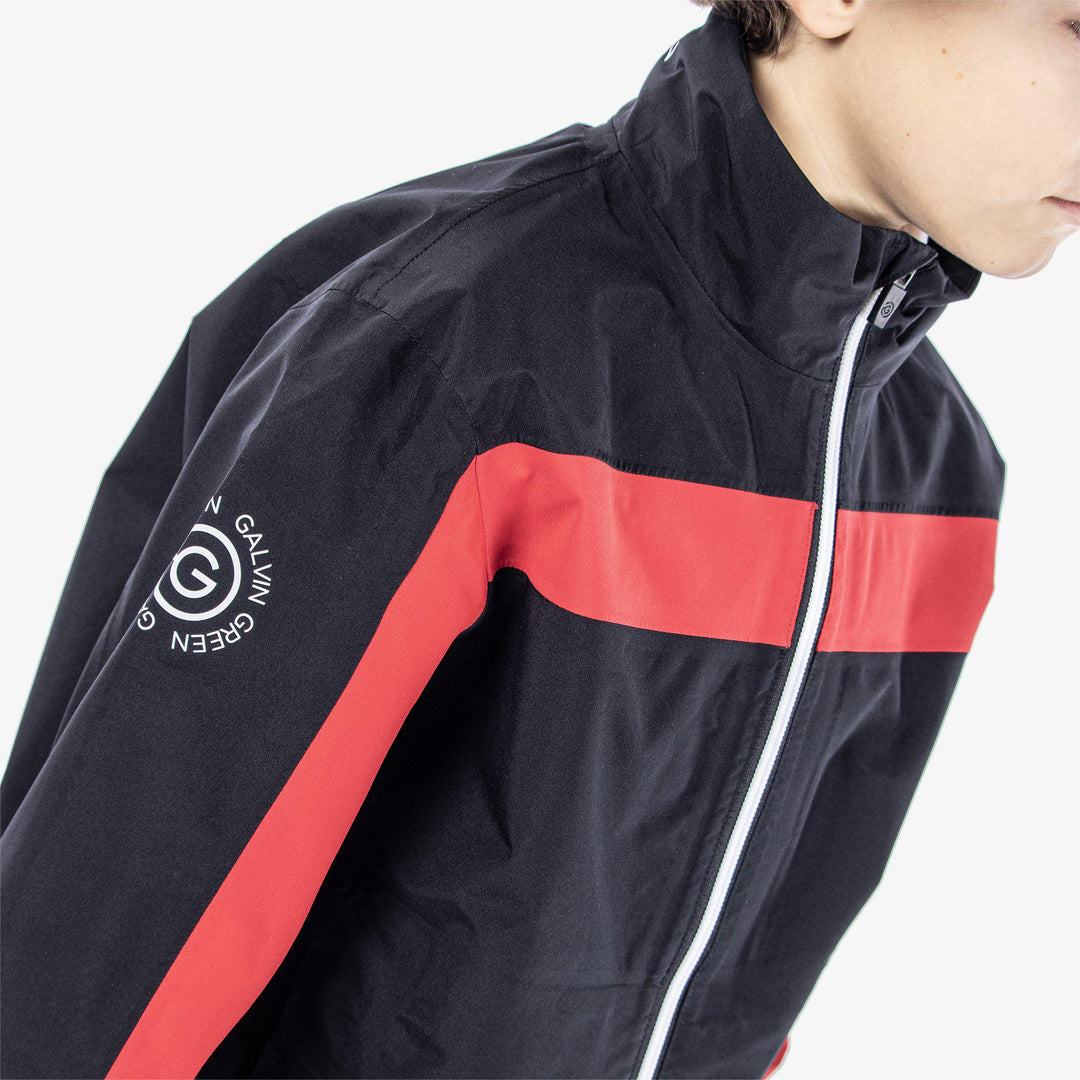 Robert is a Waterproof jacket for Juniors in the color Black/Red(4)