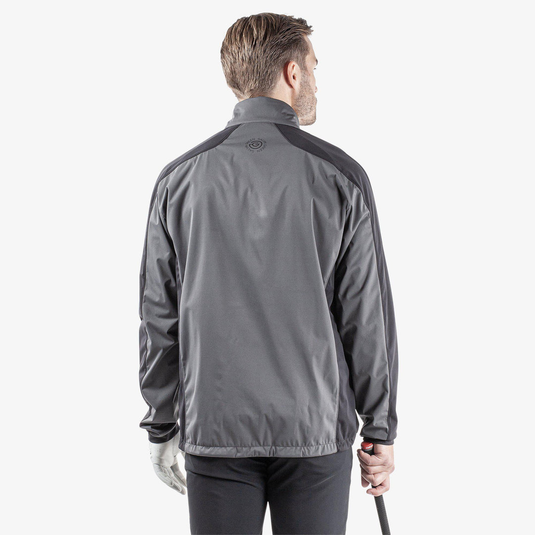 Lawrence is a Windproof and water repellent jacket for  in the color Forged Iron/Black/Red(6)