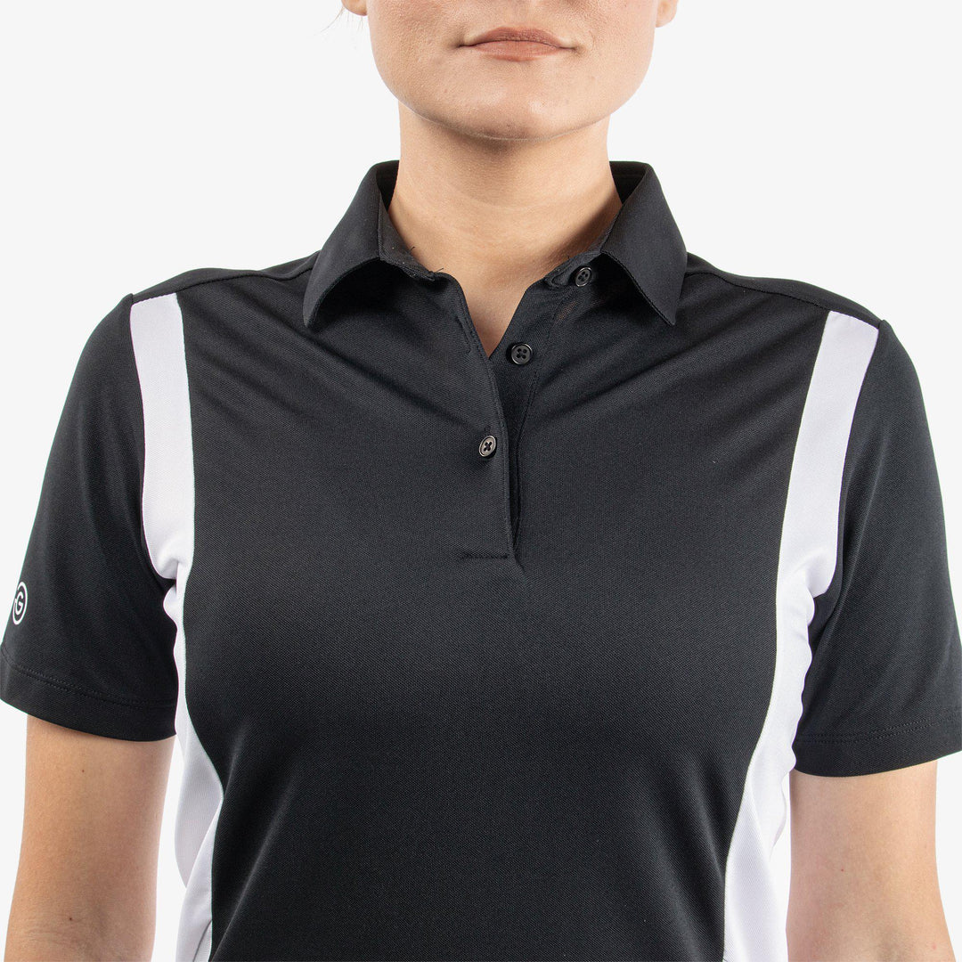 Melanie is a Breathable short sleeve golf shirt for Women in the color Black/White/Cool Grey(4)