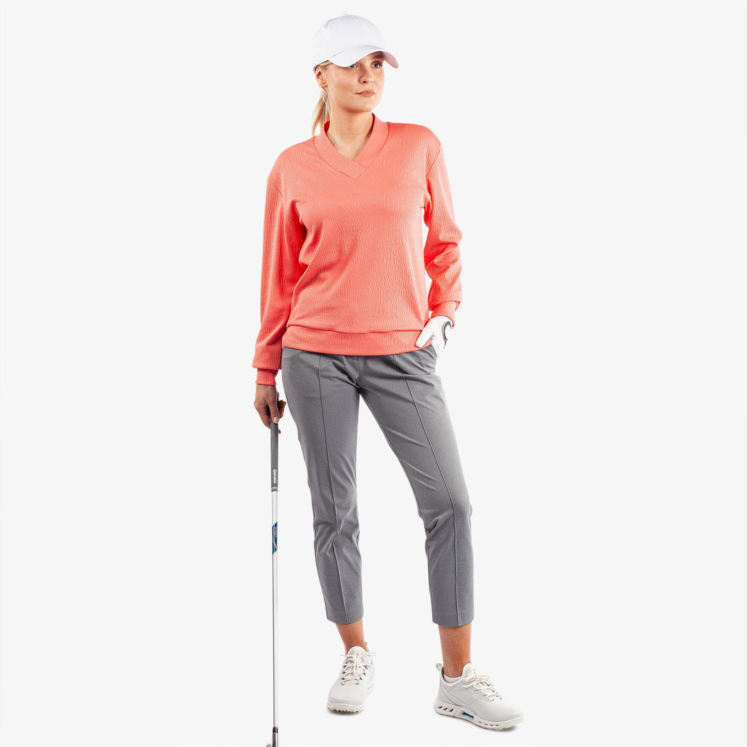 Donya is a Insulating golf mid layer for Women in the color Sugar Coral(2)