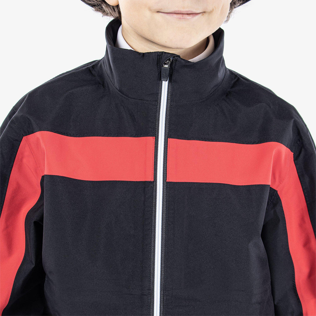 Robert is a Waterproof jacket for Juniors in the color Black/Red(3)