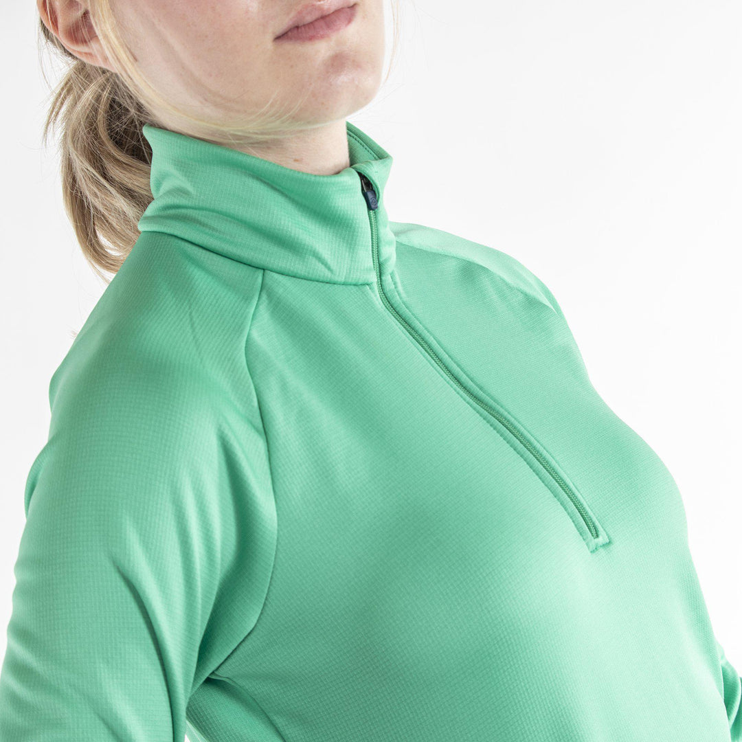 Dolly is a Insulating golf mid layer for Women in the color Holly Green(3)