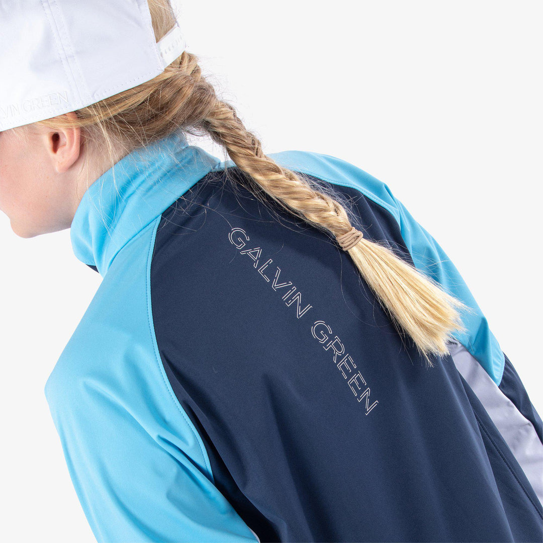 Remi is a Windproof and water repellent golf jacket for Juniors in the color Navy/Alaskan Blue/Wh(7)