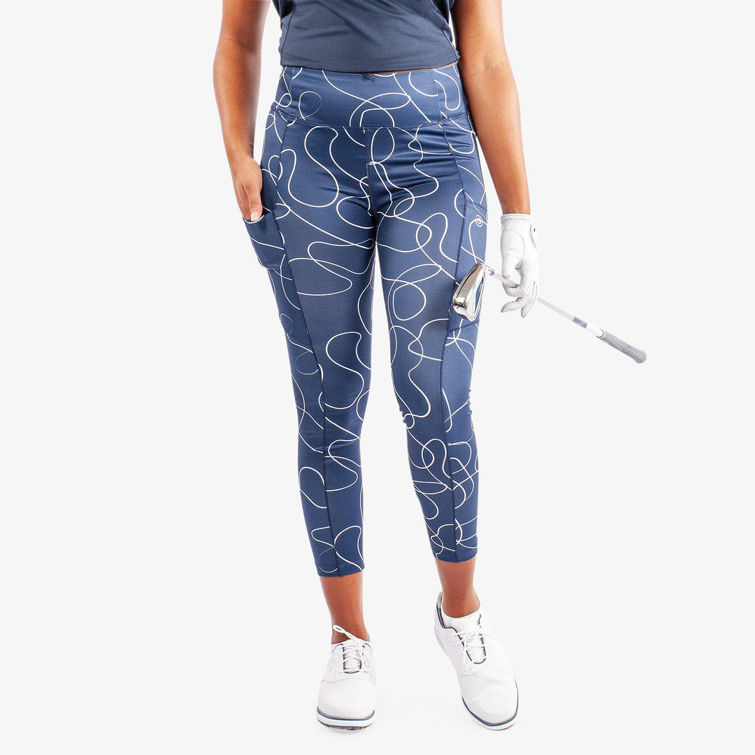 Nicoline is a Breathable and stretchy golf leggings for Women in the color Navy/White(1)
