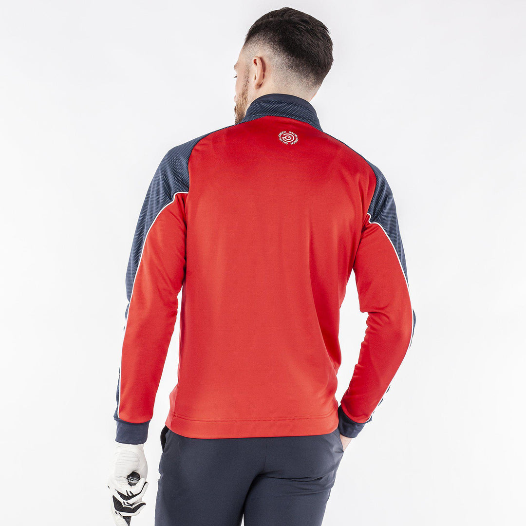 Daxton is a Insulating golf mid layer for Men in the color Sporty Red(7)