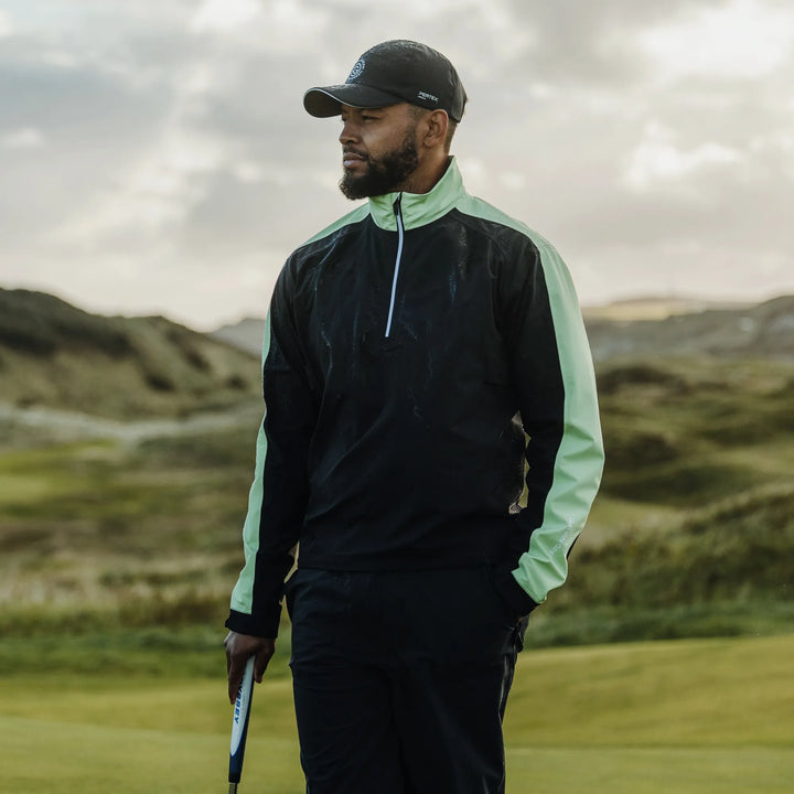 Adam is a Waterproof Golf Jacket for Men in the color Black/Fresh Green(9)