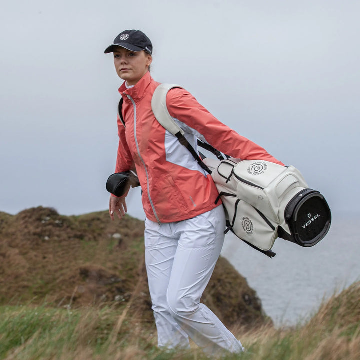 Aida is a Waterproof golf jacket for Women in the color Coral/White/Cool Grey(11)