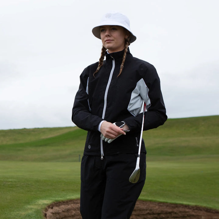 Aida is a Waterproof golf jacket for Women in the color Black/Cool Grey/White(11)