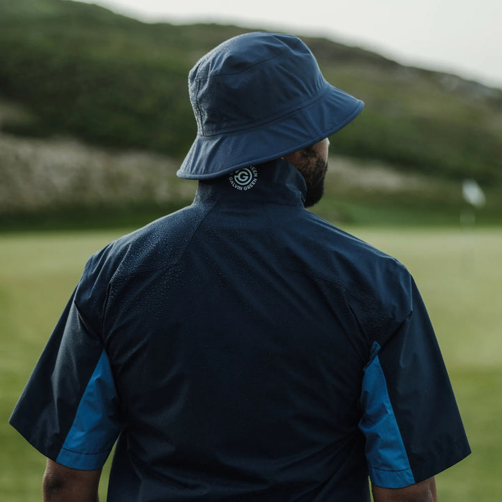 Air is a Waterproof short sleeve golf jacket for Men in the color Navy/Moonlight Blue(10)