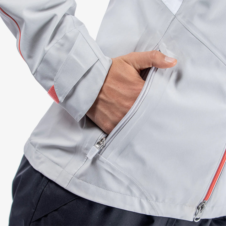 Ally is a Waterproof golf jacket for Women in the color Cool Grey/White/Coral(4)