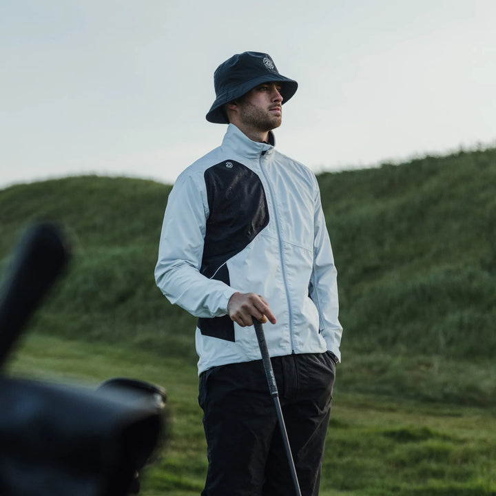 Ames is a Waterproof golf jacket for Men in the color White/Black(9)