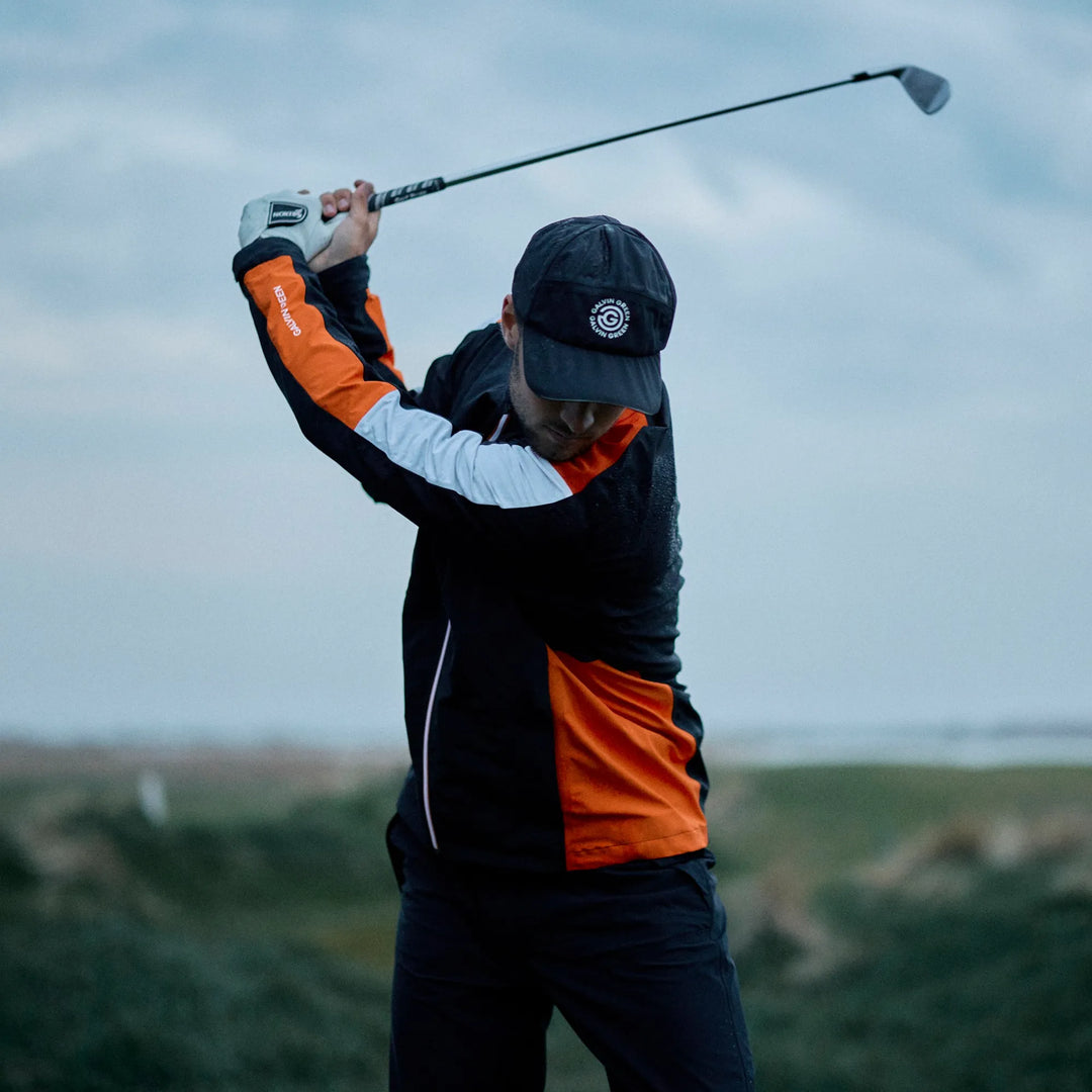 Arlo is a Waterproof Golf Jacket for Men in the color Black/Orange(7)