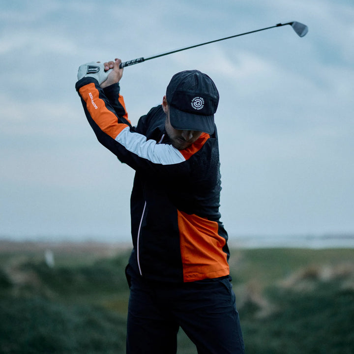 Arlo is a Waterproof Golf Jacket for Men in the color Black/Orange(7)