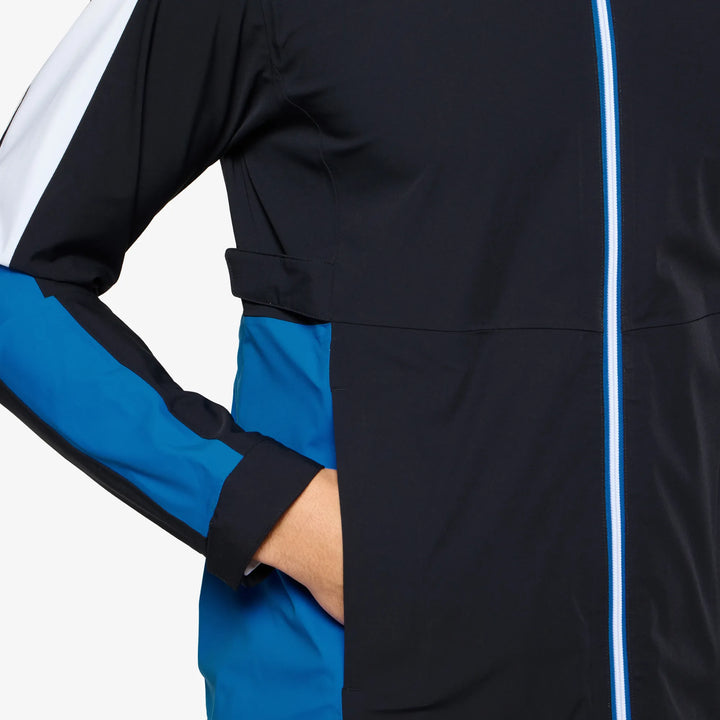 Arlo is a Waterproof Golf Jacket for Men in the color Black/Royal Blue(4)