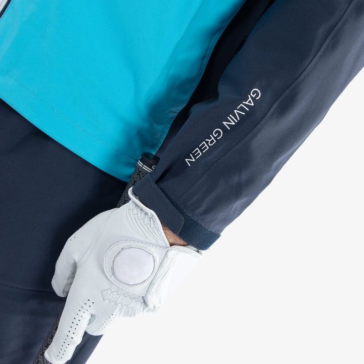 Armstrong is a Waterproof golf jacket for Men in the color Navy/Aqua/White(5)