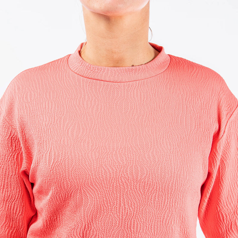 Dalia is a Insulating mid layer for Women in the color Sugar Coral(3)