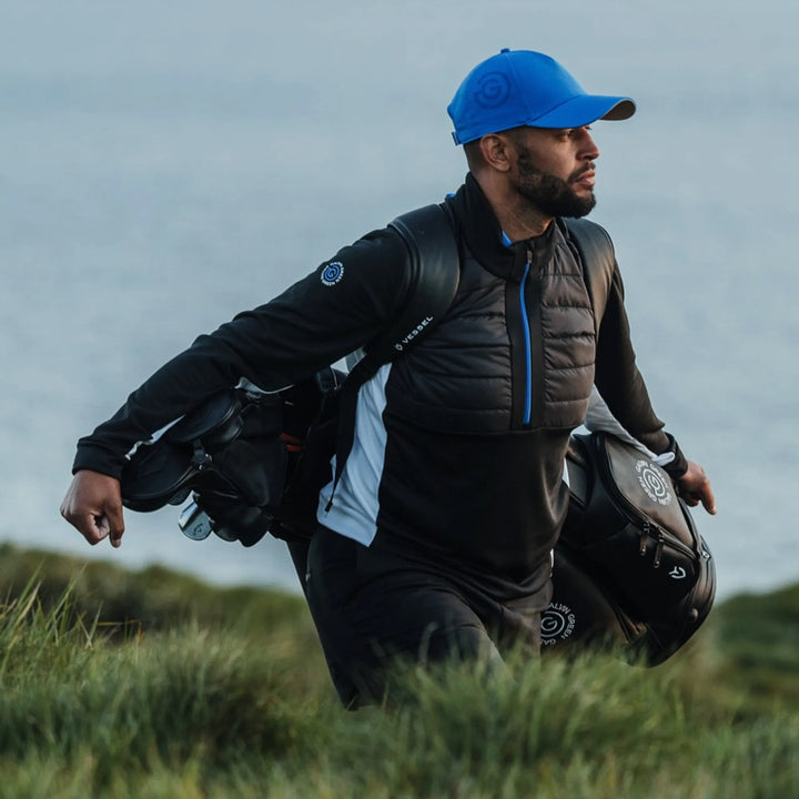 Dalton is a Insulating golf mid layer for Men in the color Black/Royal Blue(8)