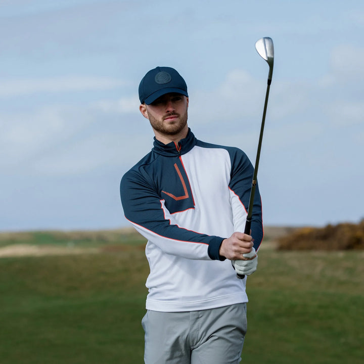 Daxton is a Insulating golf mid layer for Men in the color White/Navy/Orange(10)