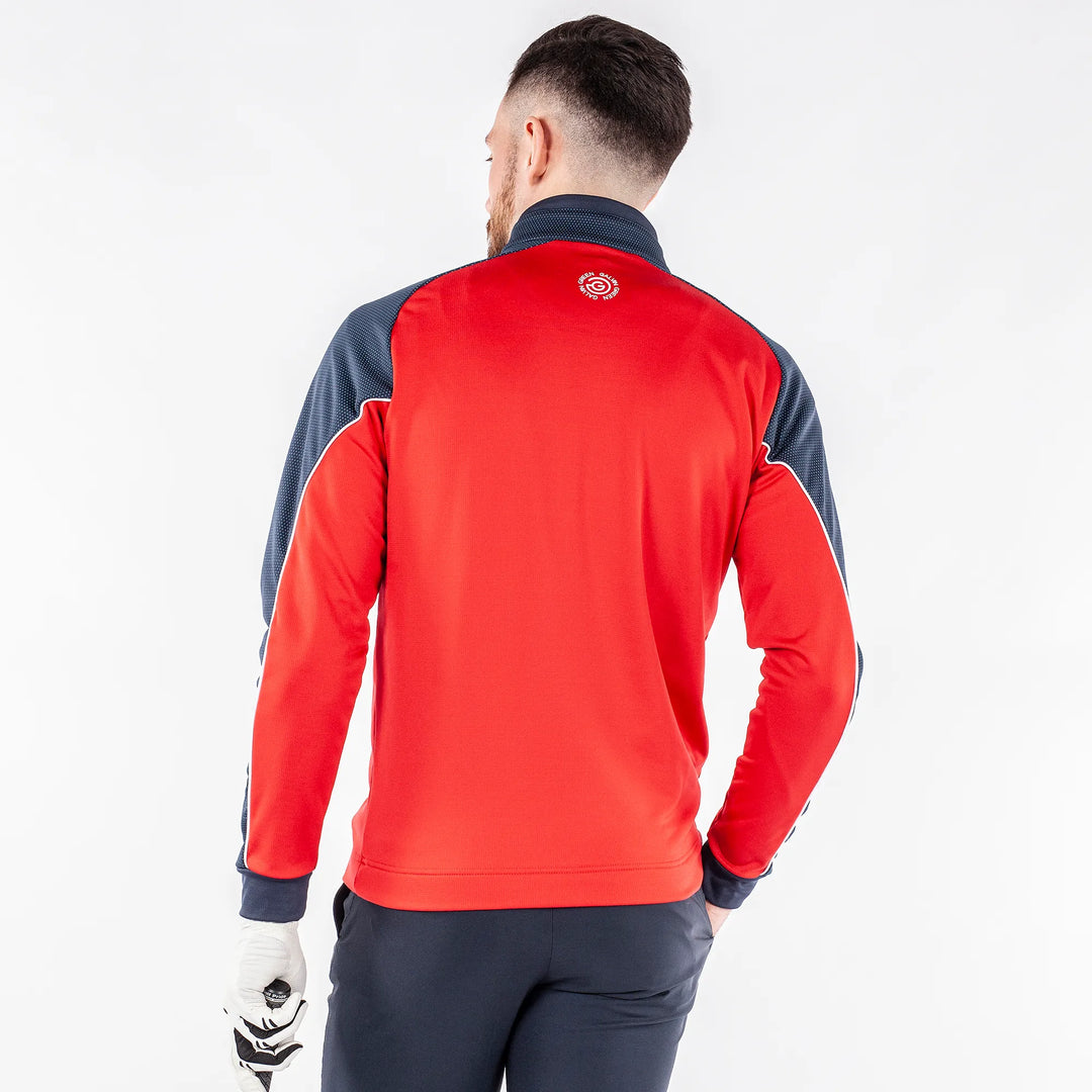 Daxton is a Insulating golf mid layer for Men in the color Sporty Red(7)