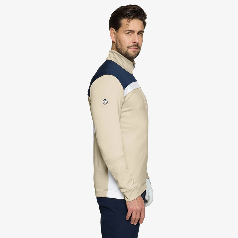 Dean is a Insulating golf mid layer for Men in the color Sand/Navy(3)