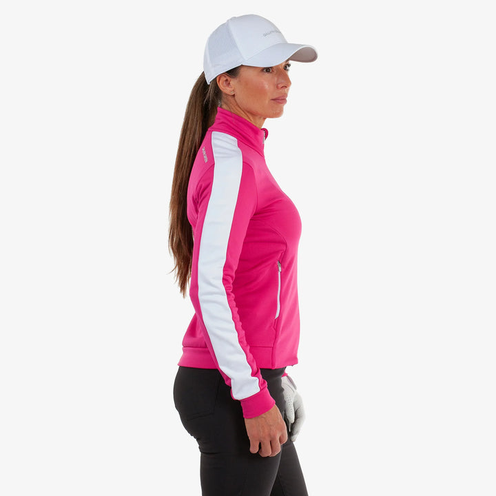 Dixie is a Insulating golf mid layer for Women in the color Fuchsia/White(3)