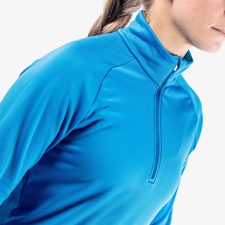 Dolly is a Insulating golf mid layer for Women in the color Blue(3)