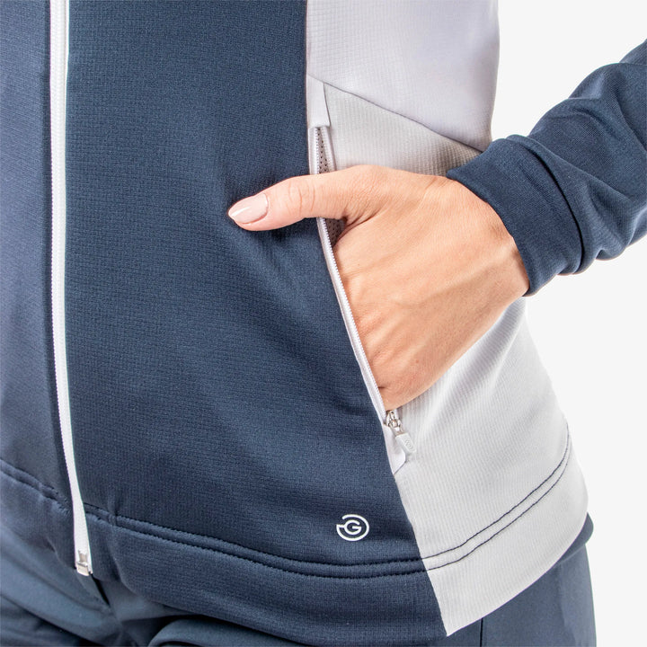 Donella is a Insulating golf mid layer for Women in the color Navy/White/Cool Grey(5)