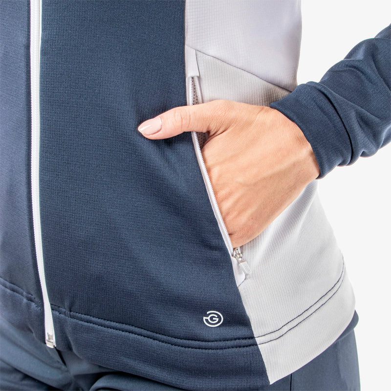 Donella is a Insulating golf mid layer for Women in the color Navy/White/Cool Grey(5)
